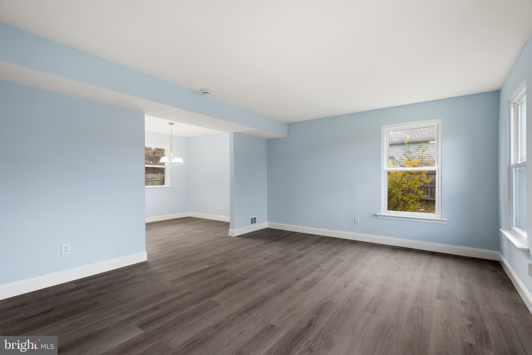 19 Windemere Court Downingtown, PA 19335 - Photo 2 of 24 an empty room with wooden floor and windows