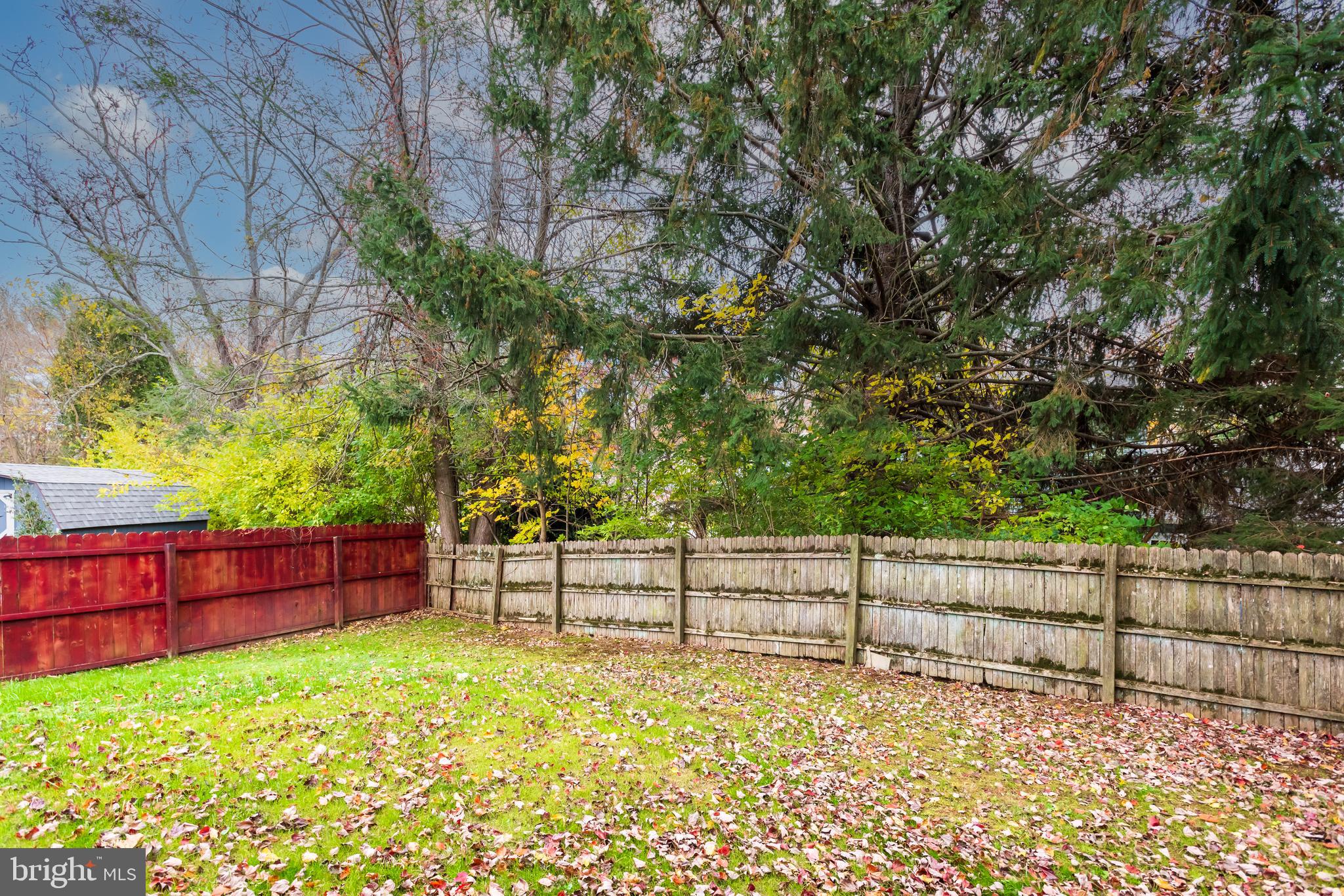 19 Windemere Court Downingtown, PA 19335 - Photo 22 of 24 a view of a yard with wooden fence