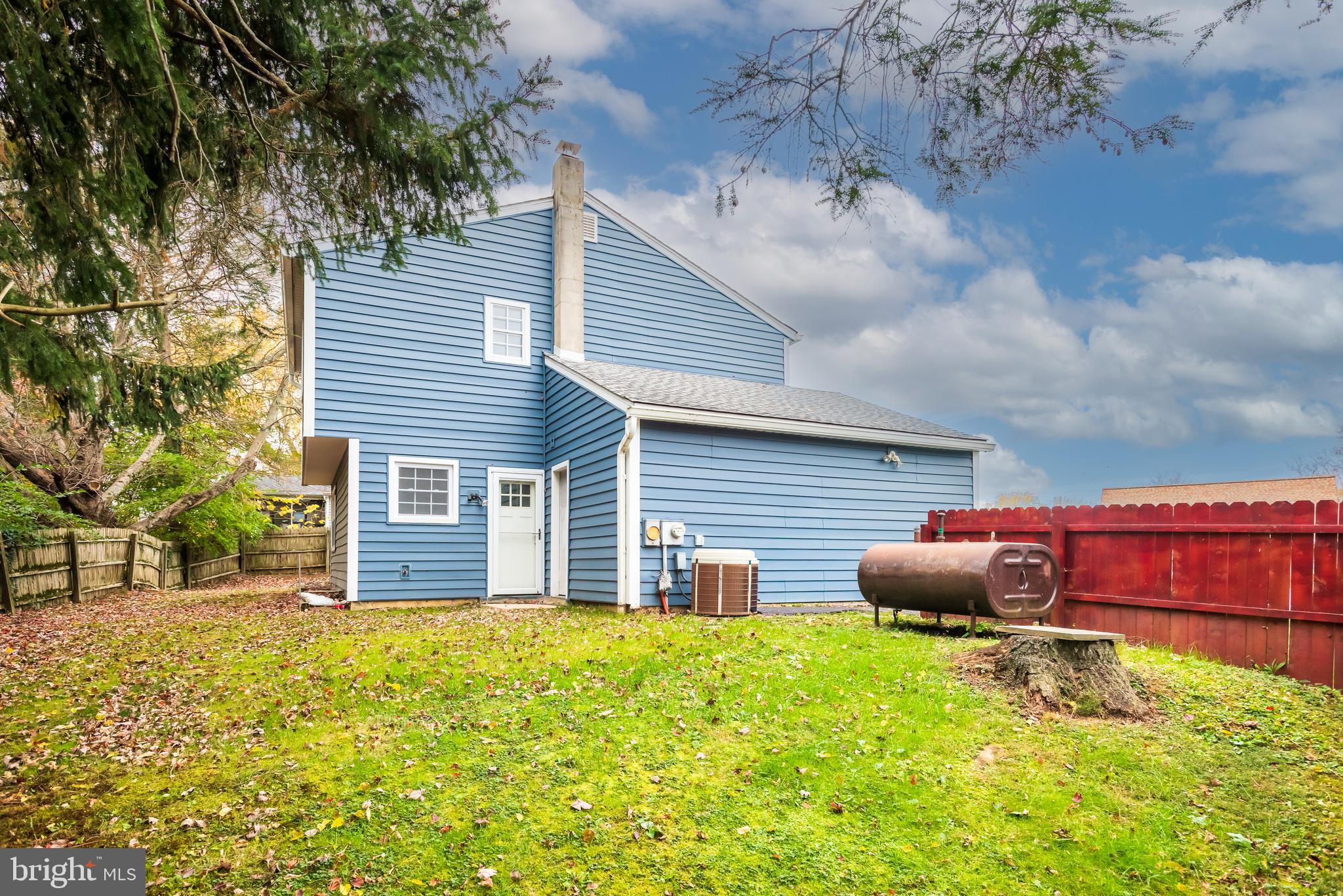 19 Windemere Court Downingtown, PA 19335 - Photo 24 of 24 a backyard of a house with table and chairs