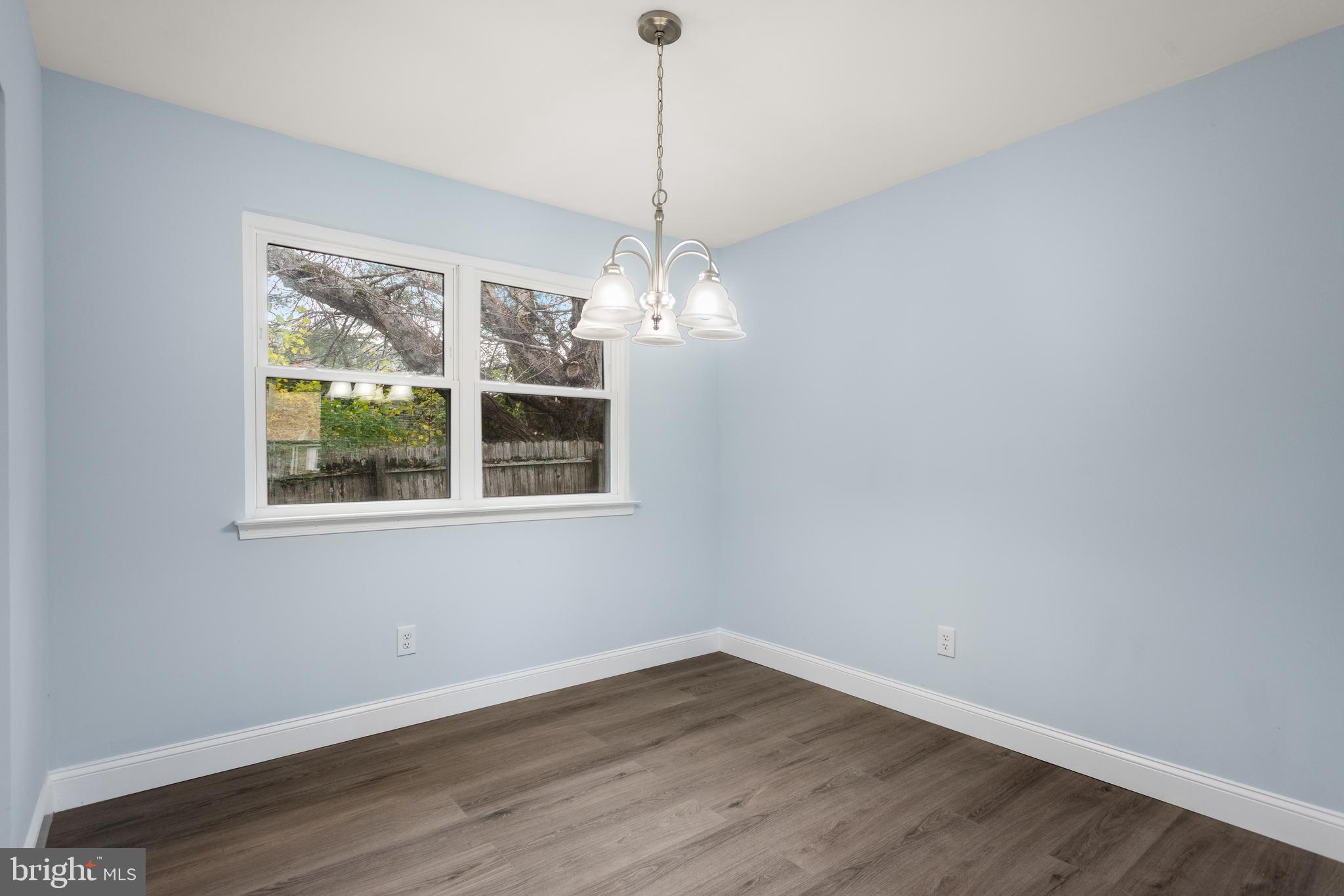 19 Windemere Court Downingtown, PA 19335 - Photo 6 of 24 a view of a room with wooden floor chandelier and windows
