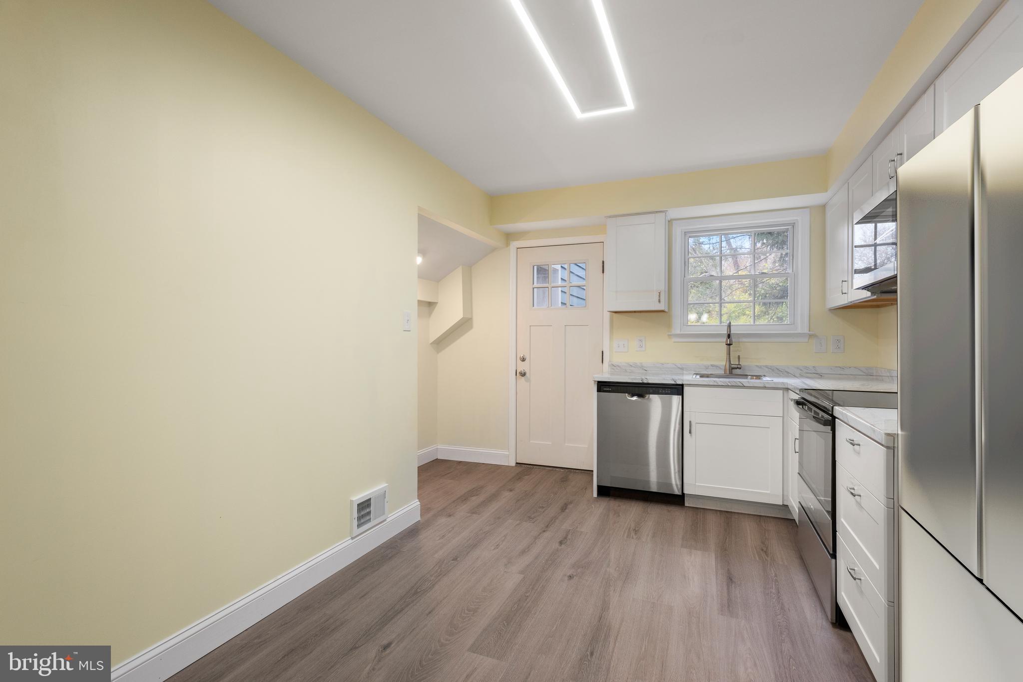 19 Windemere Court Downingtown, PA 19335 - Photo 7 of 24 a kitchen with a sink cabinets stainless steel appliances and a window