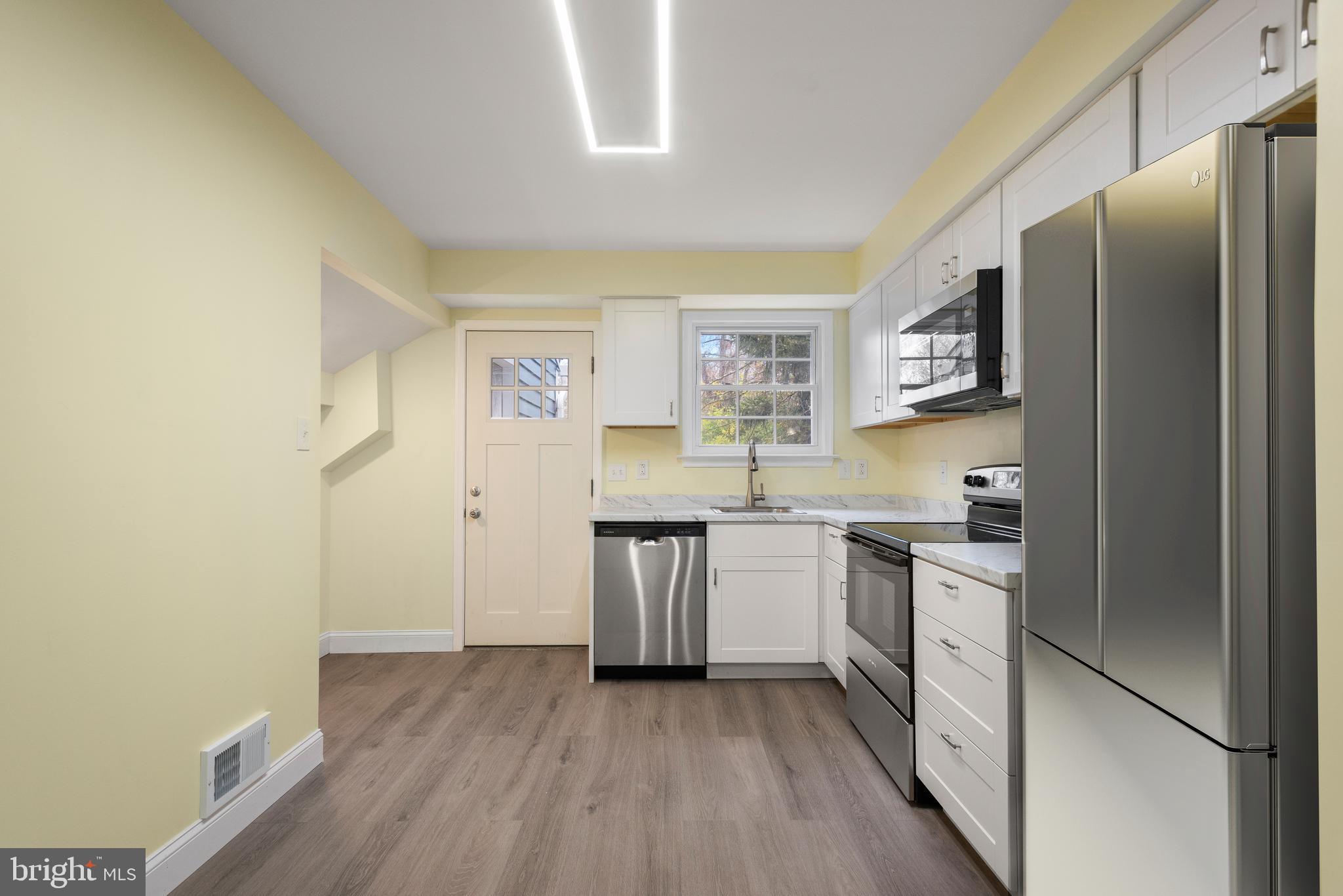 19 Windemere Court Downingtown, PA 19335 - Photo 8 of 24 a kitchen with stainless steel appliances granite countertop a refrigerator and a stove top oven