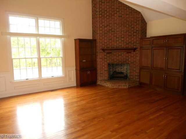 185 Williams Road Madison, NC 27025 - Photo 4 of 16 Living Room. Vaulted ceiling,hardwood floor, gas logs, built ins & french doors
