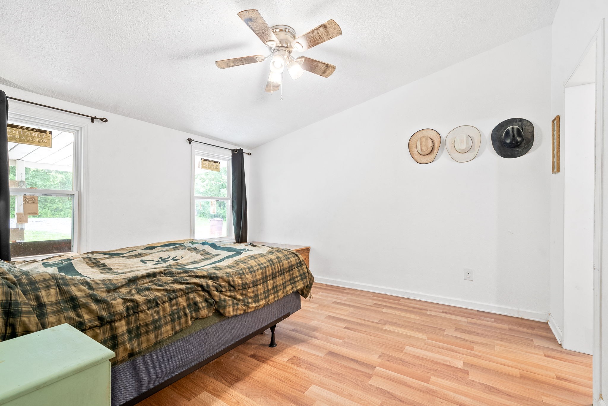 110 Little Fork Road Cumberland City, TN 37050 - Photo 14 of 32 a bedroom with a bed and a window