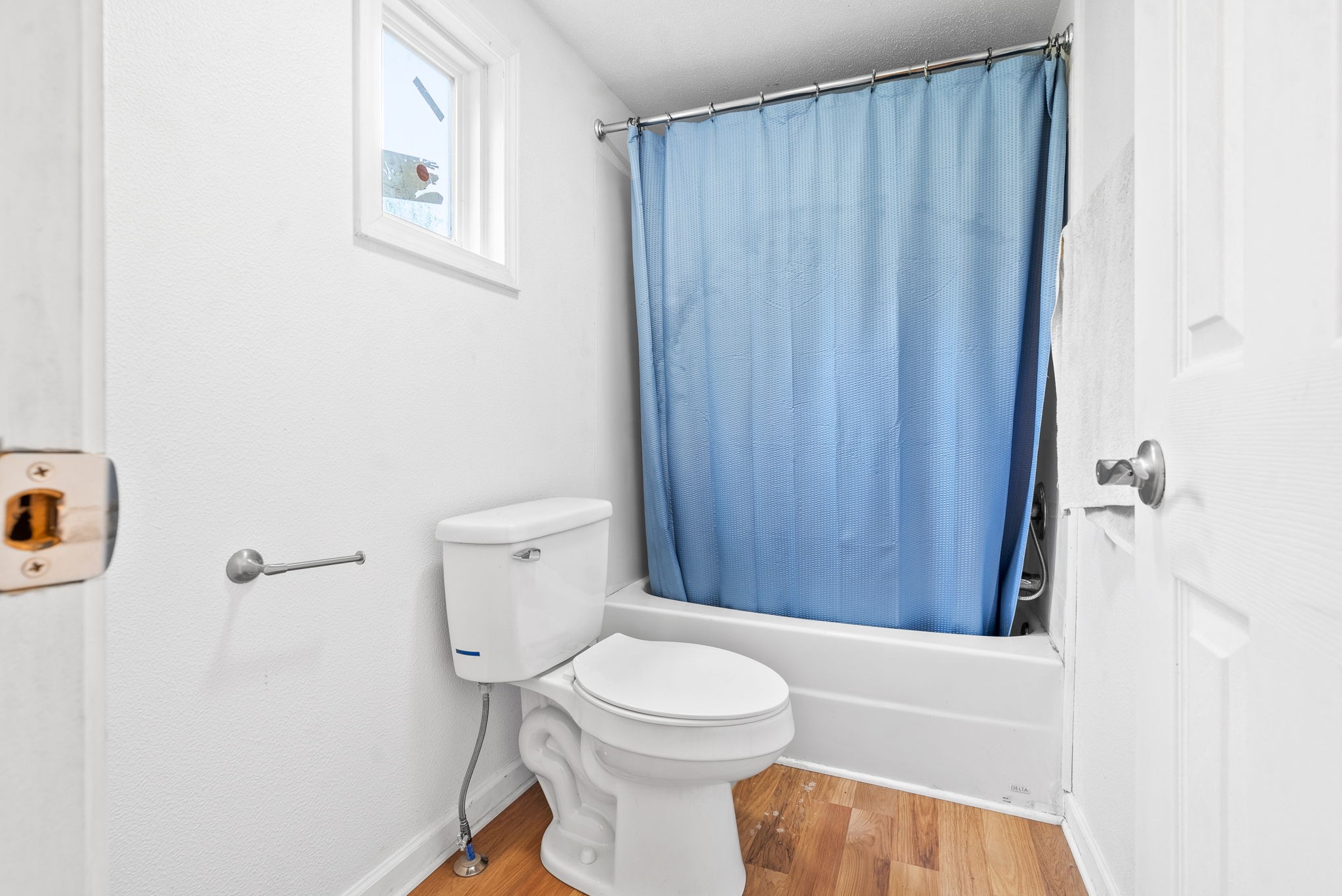 110 Little Fork Road Cumberland City, TN 37050 - Photo 17 of 32 a bathroom with a toilet a sink and bathtub
