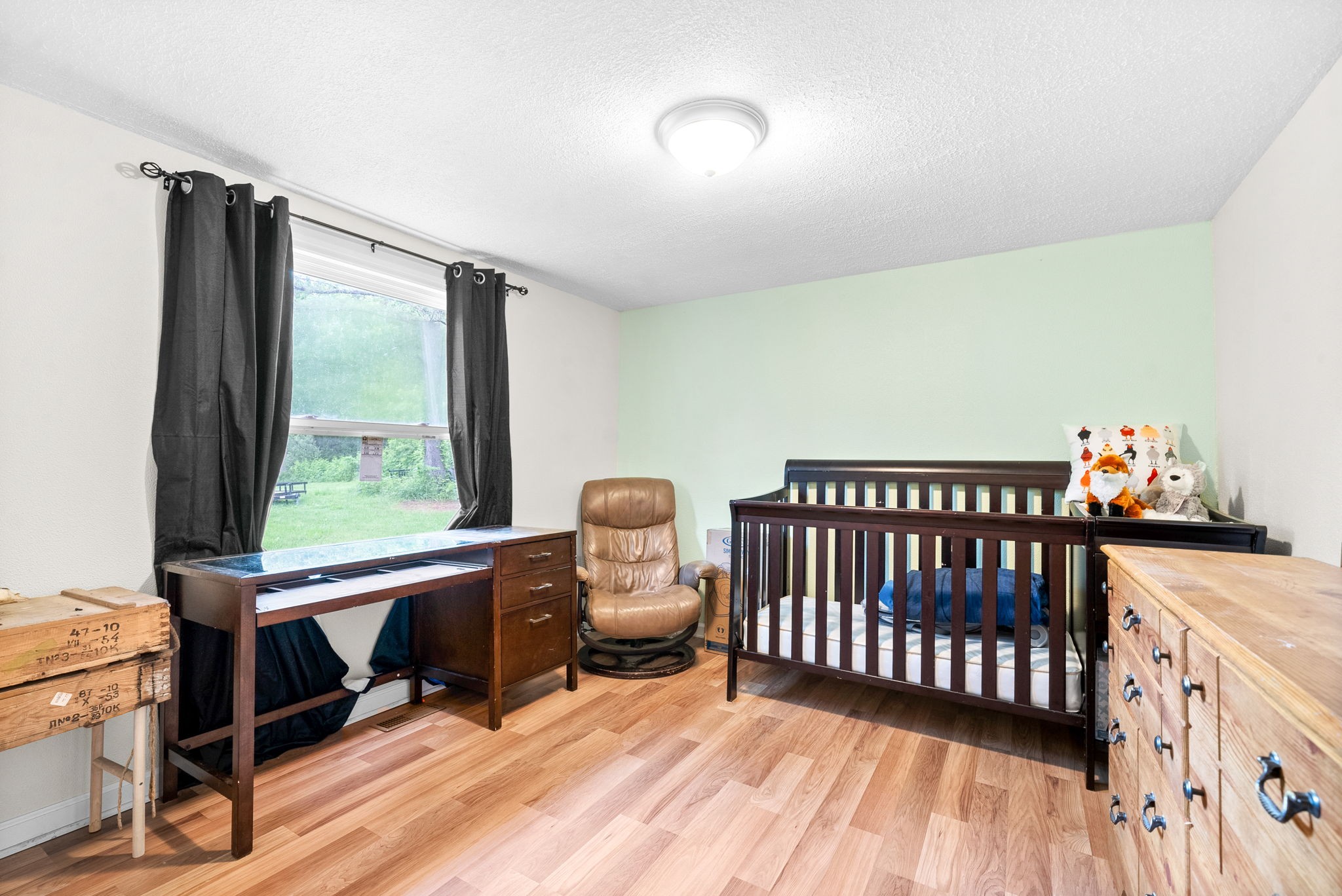 110 Little Fork Road Cumberland City, TN 37050 - Photo 18 of 32 a bedroom with furniture and a window