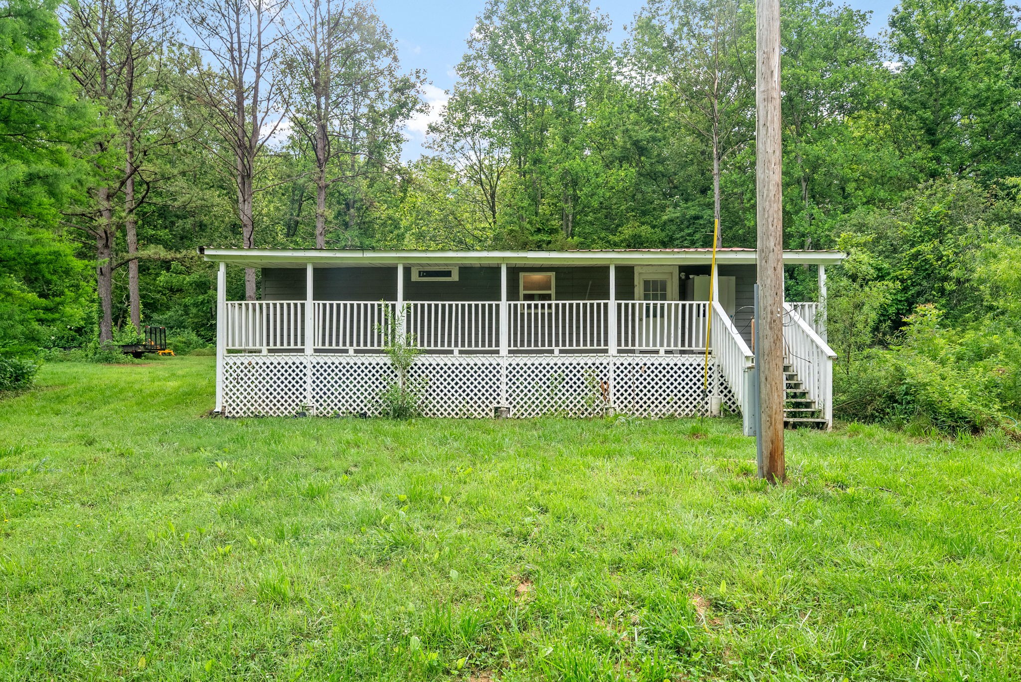 110 Little Fork Road Cumberland City, TN 37050 - Photo 24 of 32 a view of a house with backyard