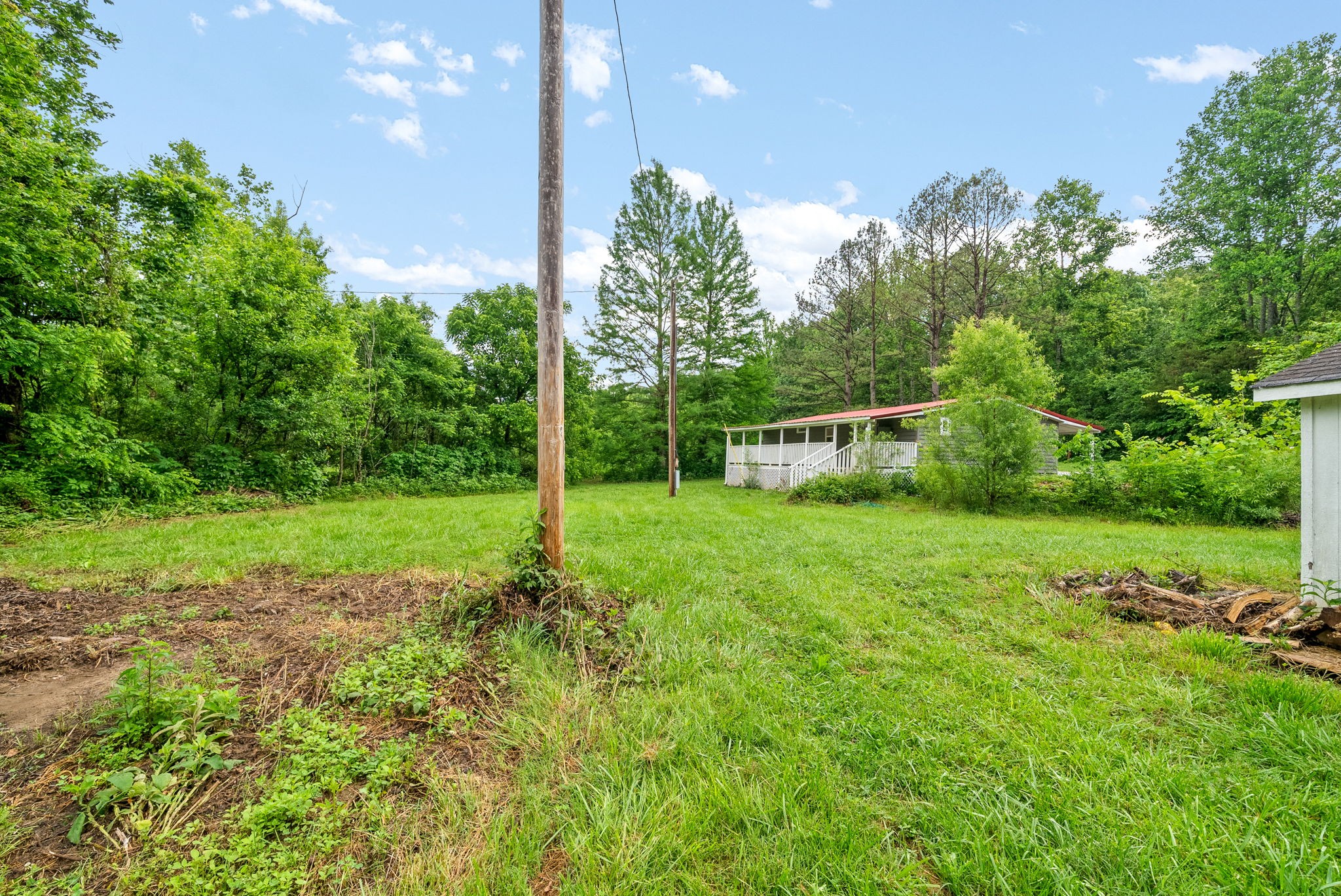 110 Little Fork Road Cumberland City, TN 37050 - Photo 27 of 32 a view of a backyard with a garden