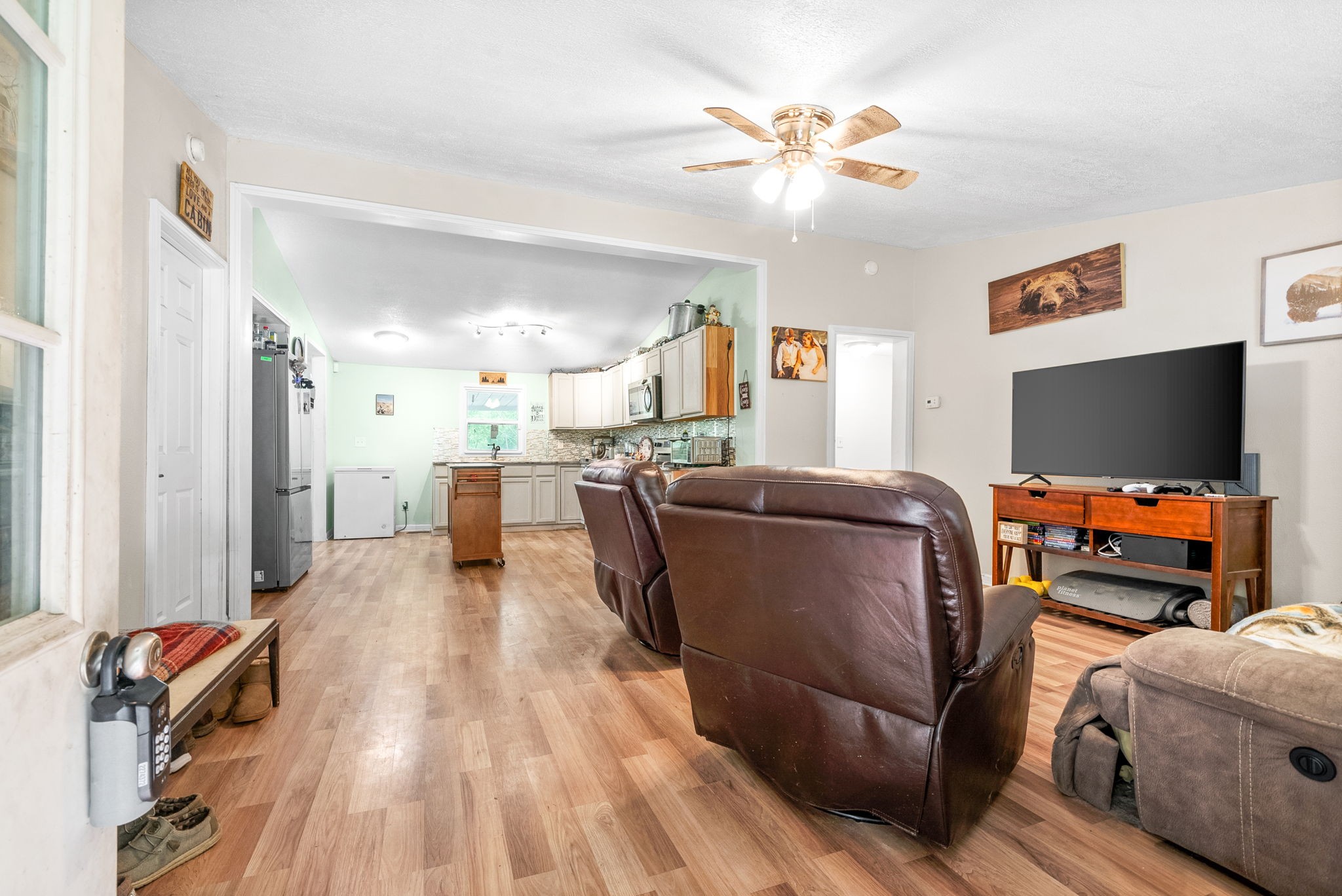 110 Little Fork Road Cumberland City, TN 37050 - Photo 5 of 32 a living room with furniture and a flat screen tv
