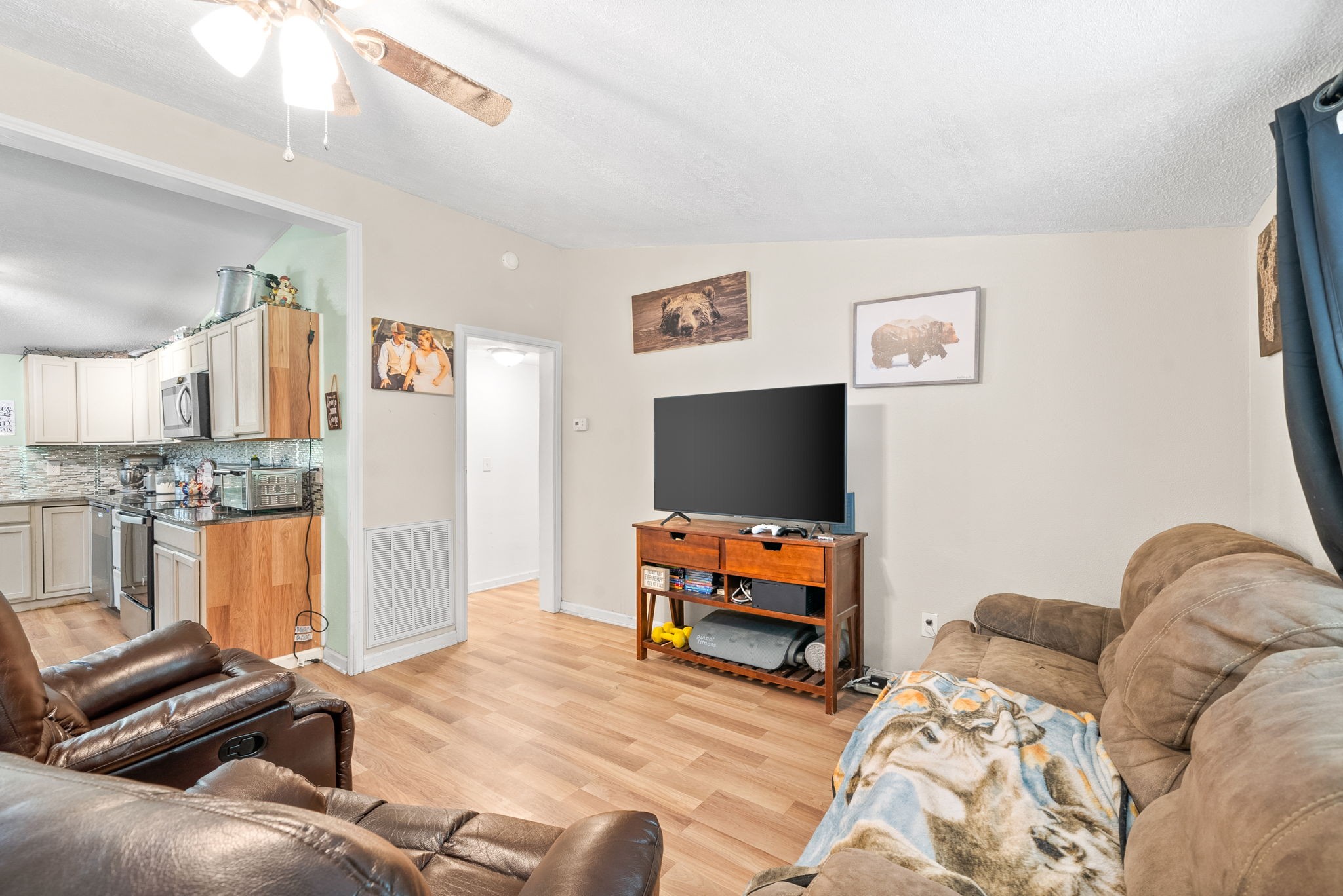 110 Little Fork Road Cumberland City, TN 37050 - Photo 6 of 32 a bedroom with furniture and a flat screen tv