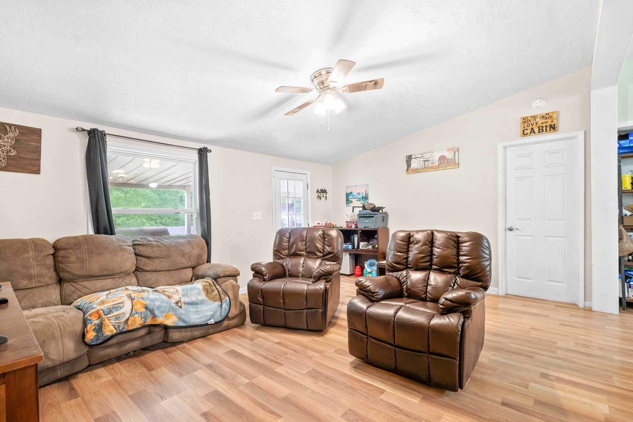 110 Little Fork Road Cumberland City, TN 37050 - Photo 9 of 32 a living room with furniture and a large window