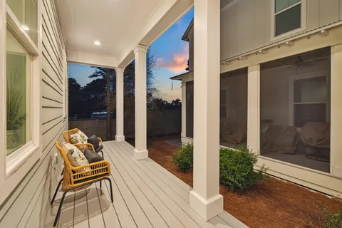 a balcony with wooden floor and outdoor view