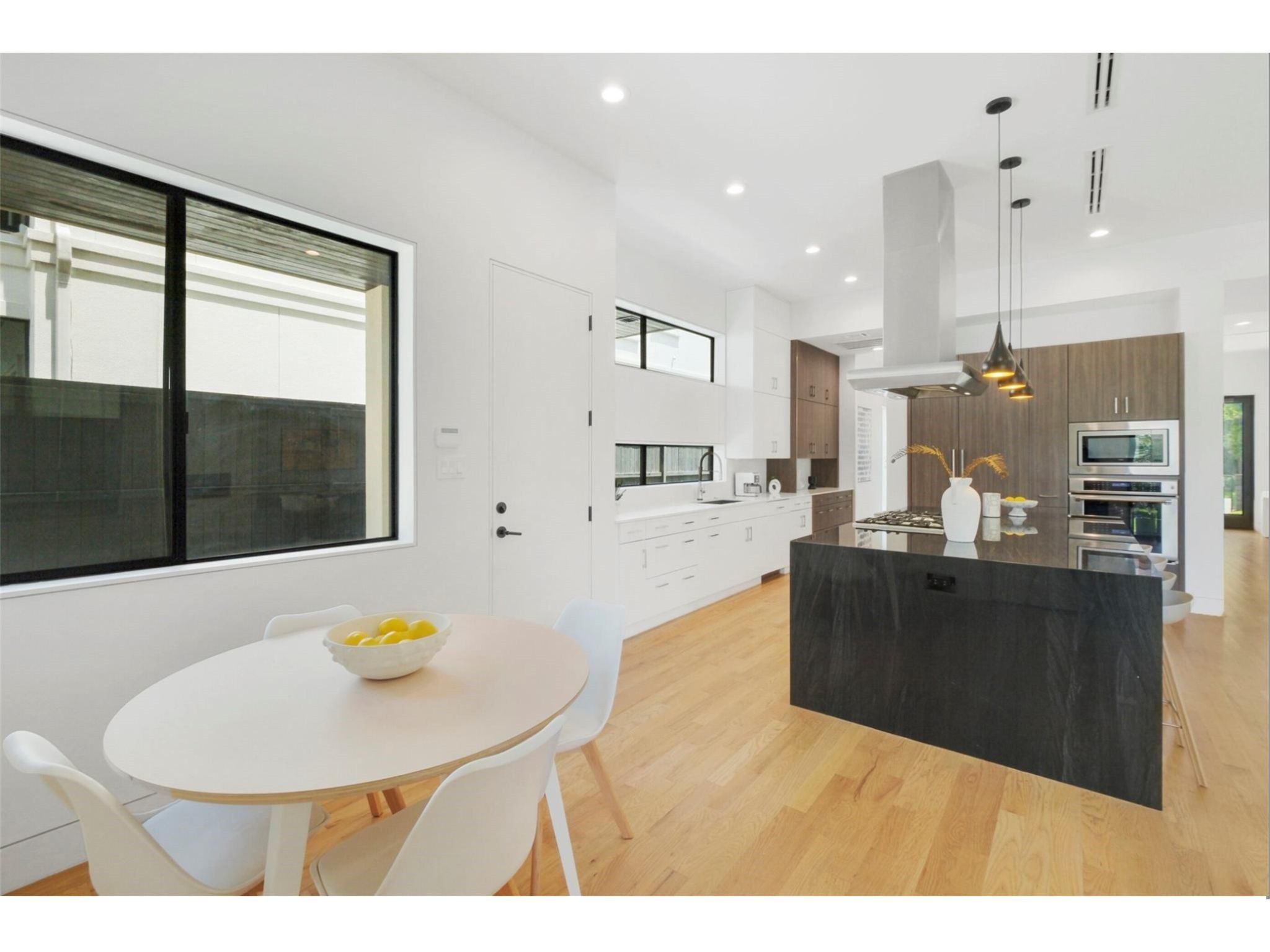 1912 Kipling Street Houston, TX 77098 - Photo 12 of 30 a kitchen with a table and chairs