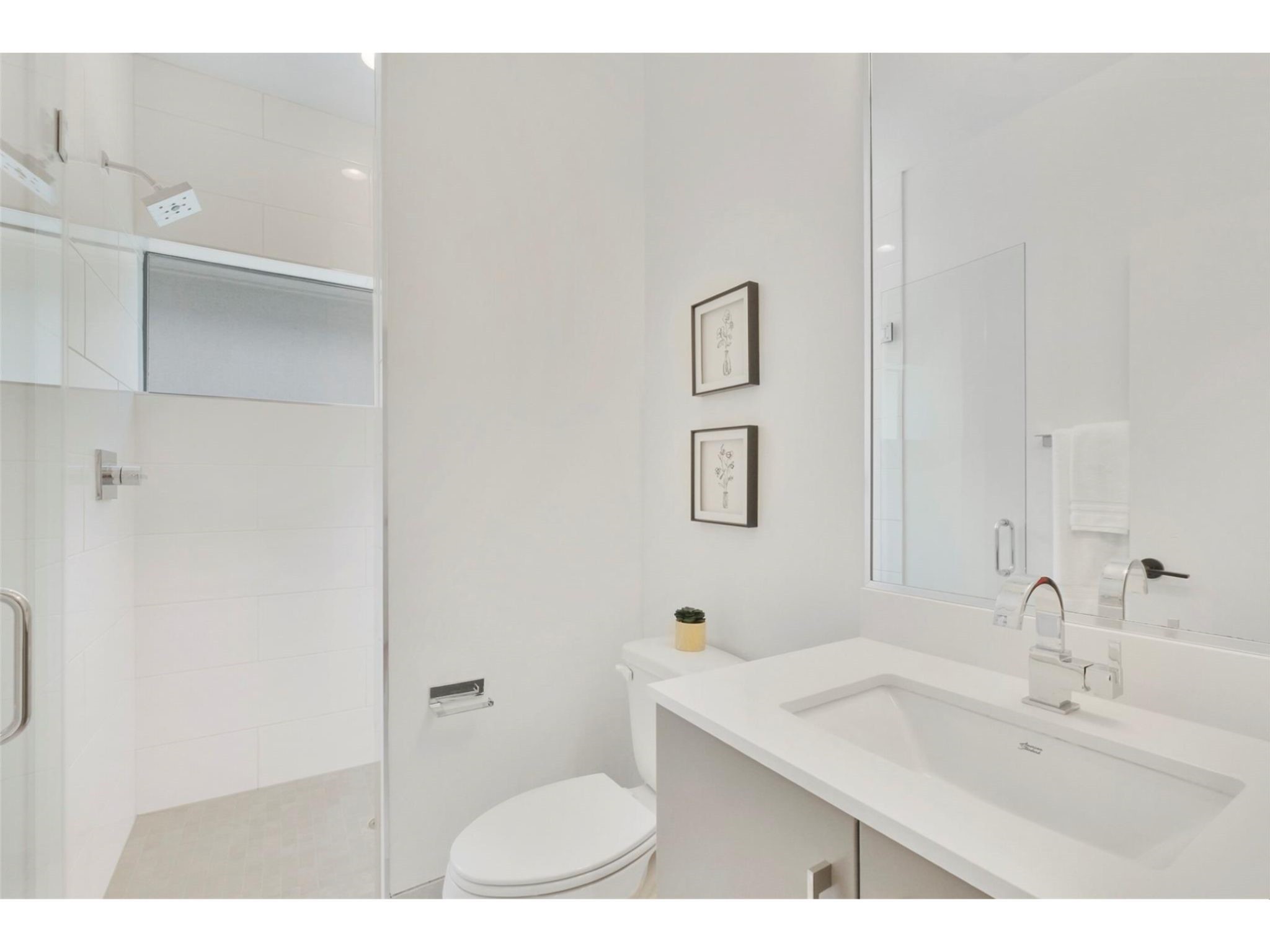 1912 Kipling Street Houston, TX 77098 - Photo 18 of 30 a bathroom with a sink toilet and mirror