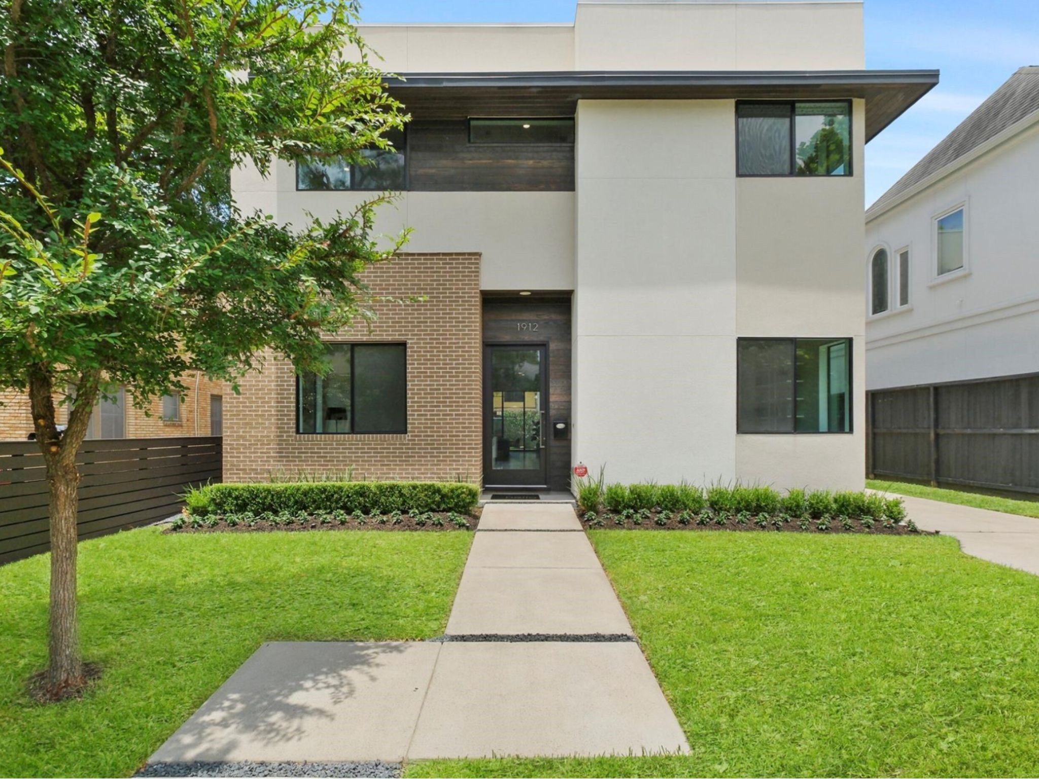 1912 Kipling Street Houston, TX 77098 - Photo 2 of 30 a front view of a house with a yard