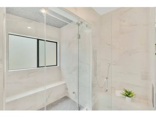a bathroom with a bathtub and a shower