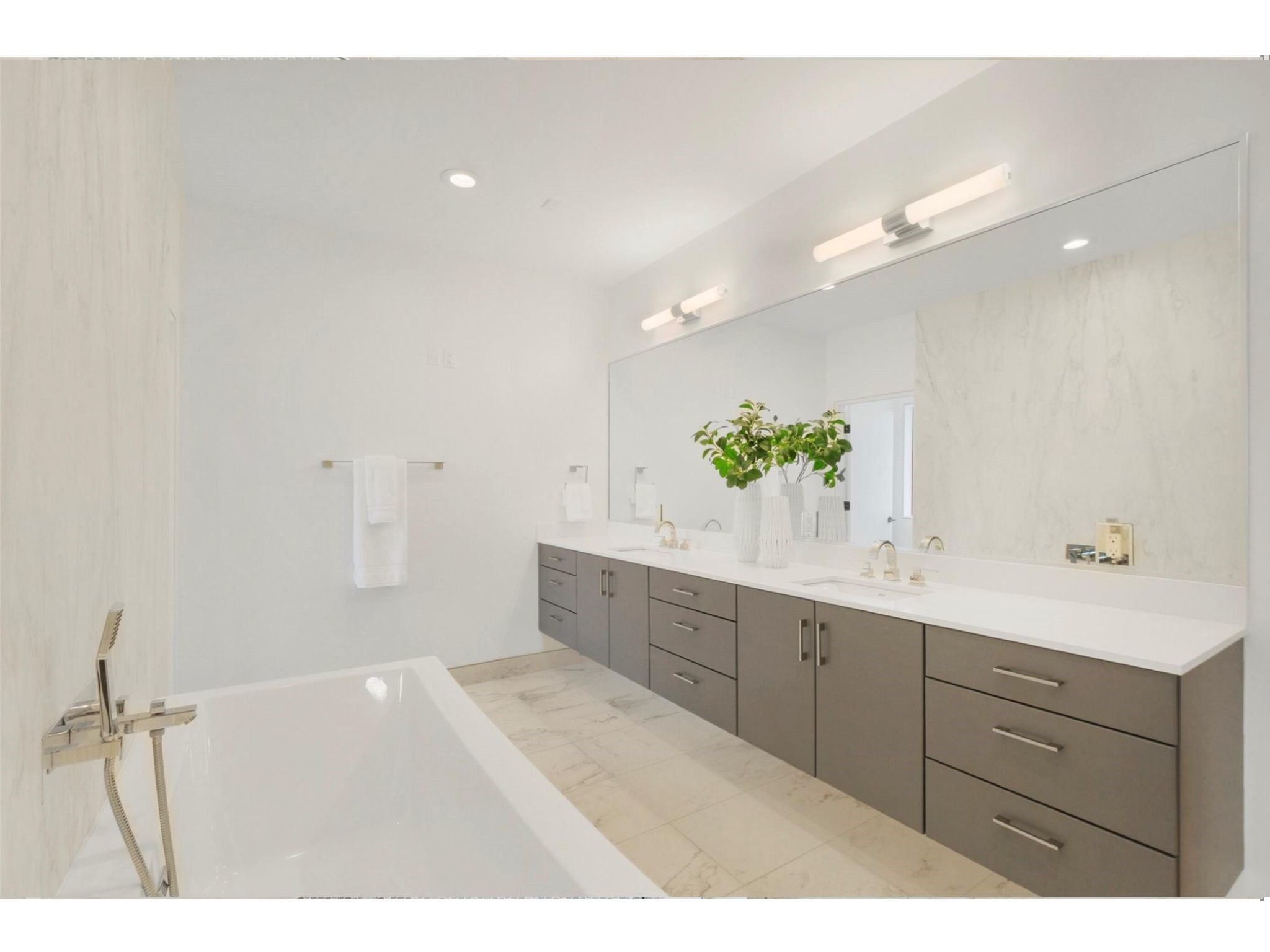1912 Kipling Street Houston, TX 77098 - Photo 24 of 30 a bathroom with a sink mirror and a shower