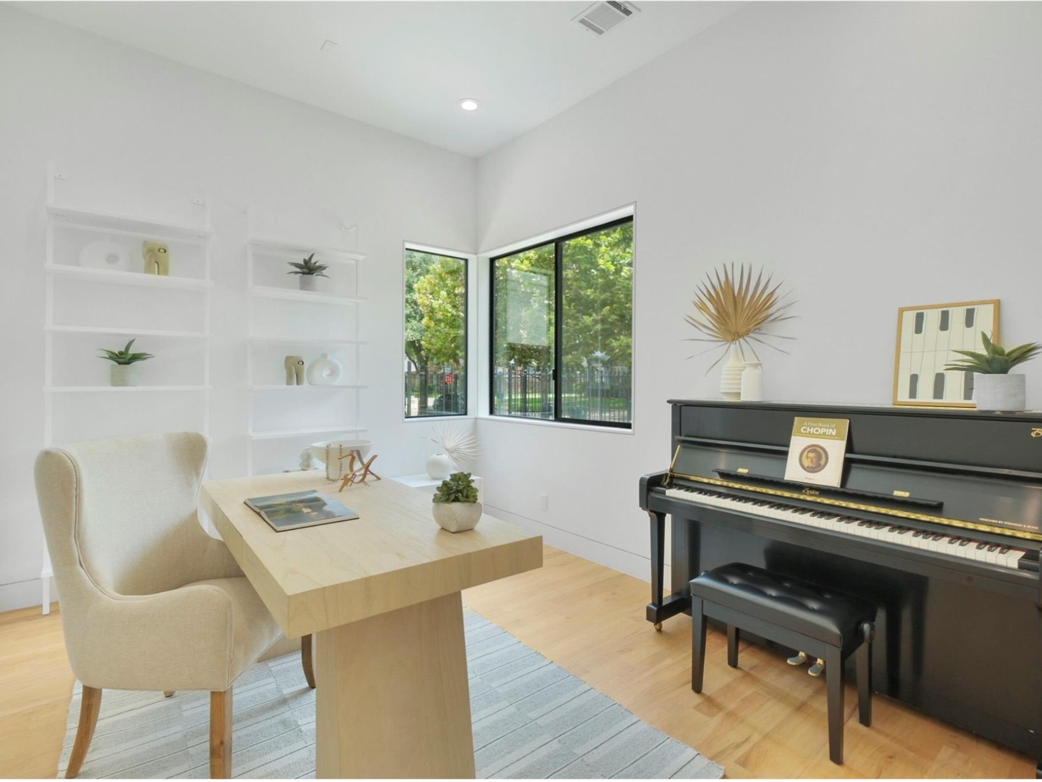 1912 Kipling Street Houston, TX 77098 - Photo 4 of 30 a view of a workspace with furniture and a potted plant