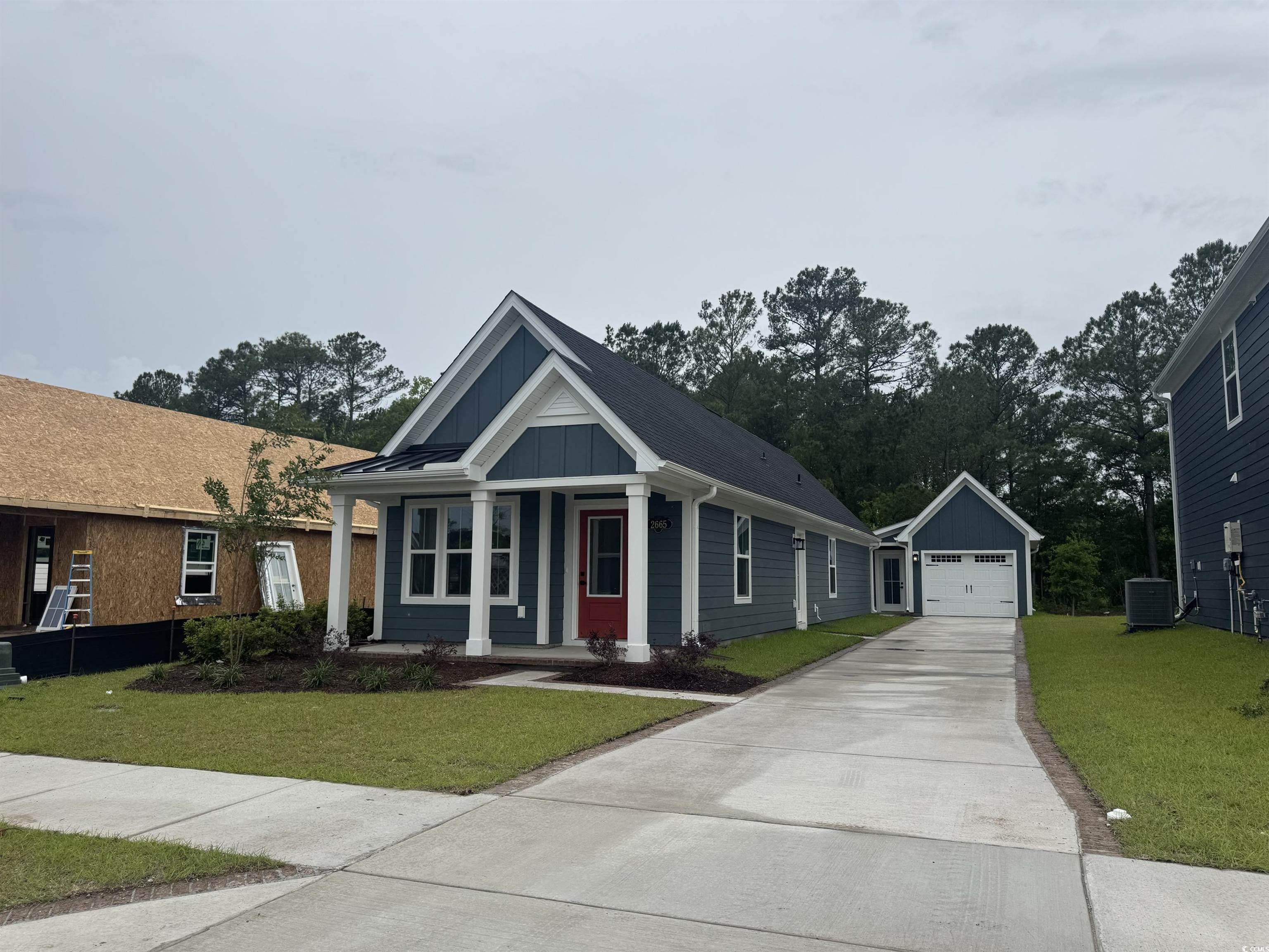 2665 Rowyn Street Longs, SC 29568 - Photo 1 of 1 View of front facade with board and batten siding,