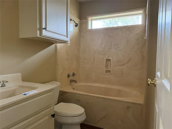 a bathroom with a sink and a window