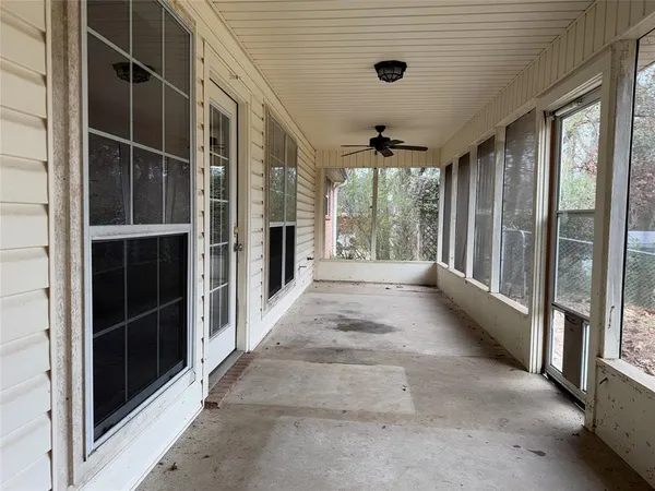 a backyard of a house with large trees
