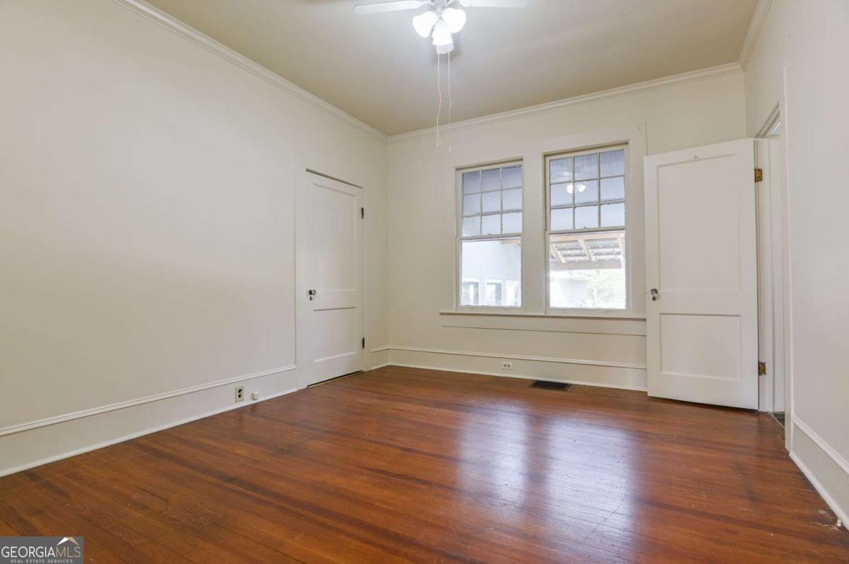 120 Tusten Street Elberton, GA 30635 - Photo 19 of 49 wooden floor in an empty room with a window