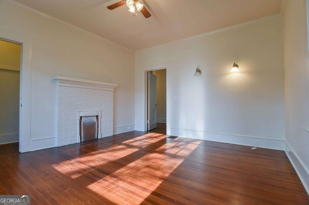 120 Tusten Street Elberton, GA 30635 - Photo 24 of 49 a view of an empty room with wooden floor