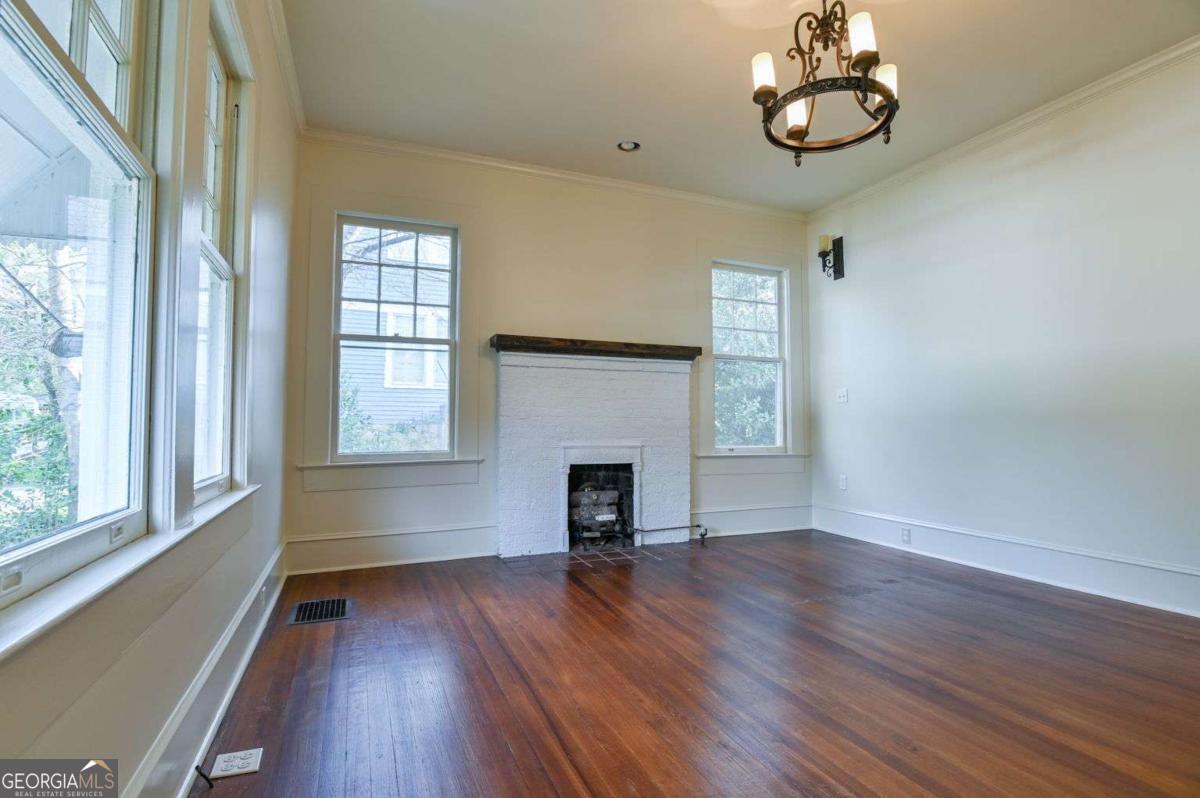 120 Tusten Street Elberton, GA 30635 - Photo 25 of 49 wooden floor in an empty room with a window