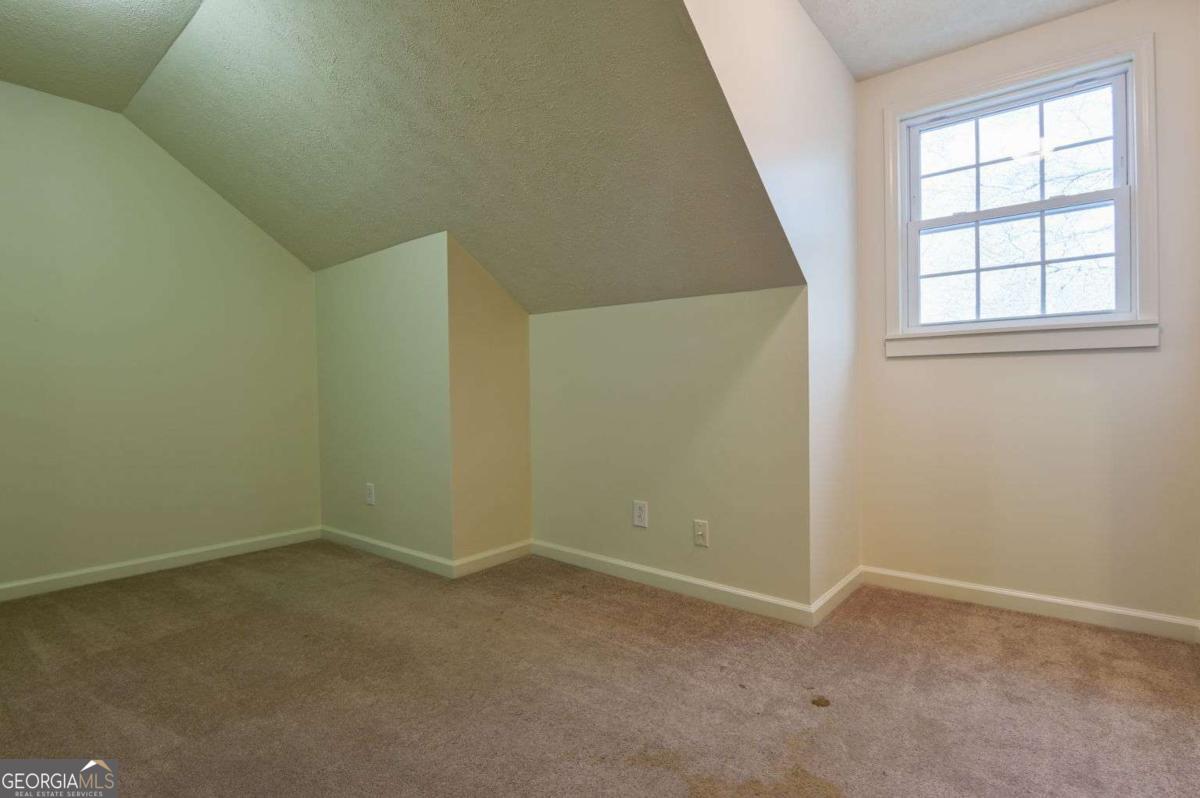 120 Tusten Street Elberton, GA 30635 - Photo 31 of 49 an empty room with windows