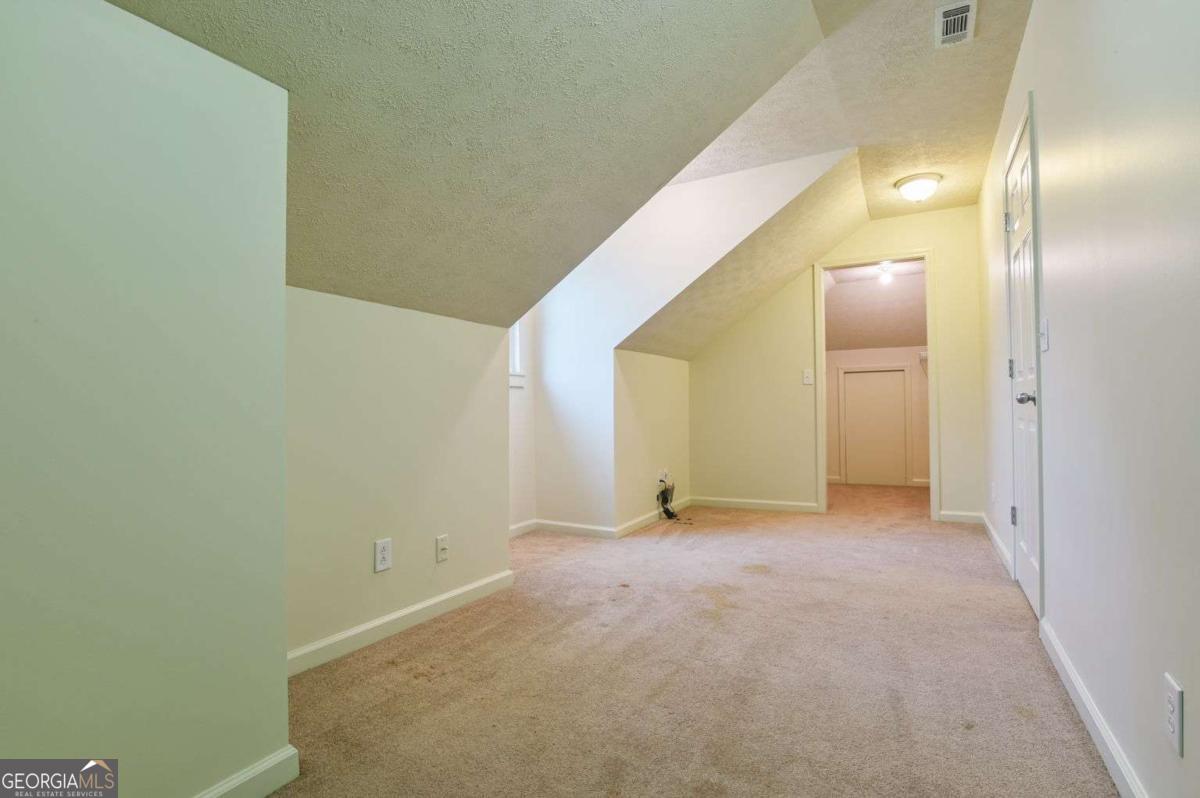 120 Tusten Street Elberton, GA 30635 - Photo 32 of 49 a view of an empty room with wooden floor
