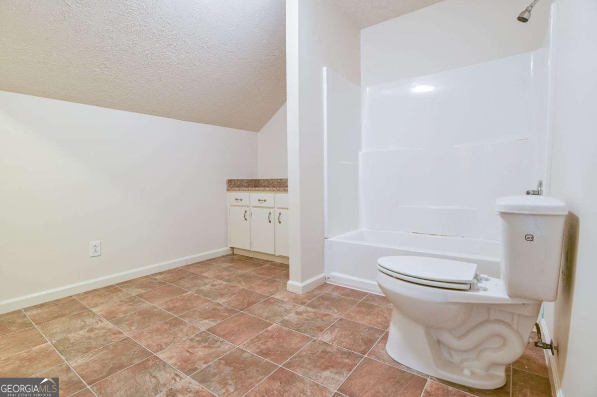 120 Tusten Street Elberton, GA 30635 - Photo 34 of 49 a bathroom with a toilet and a shower