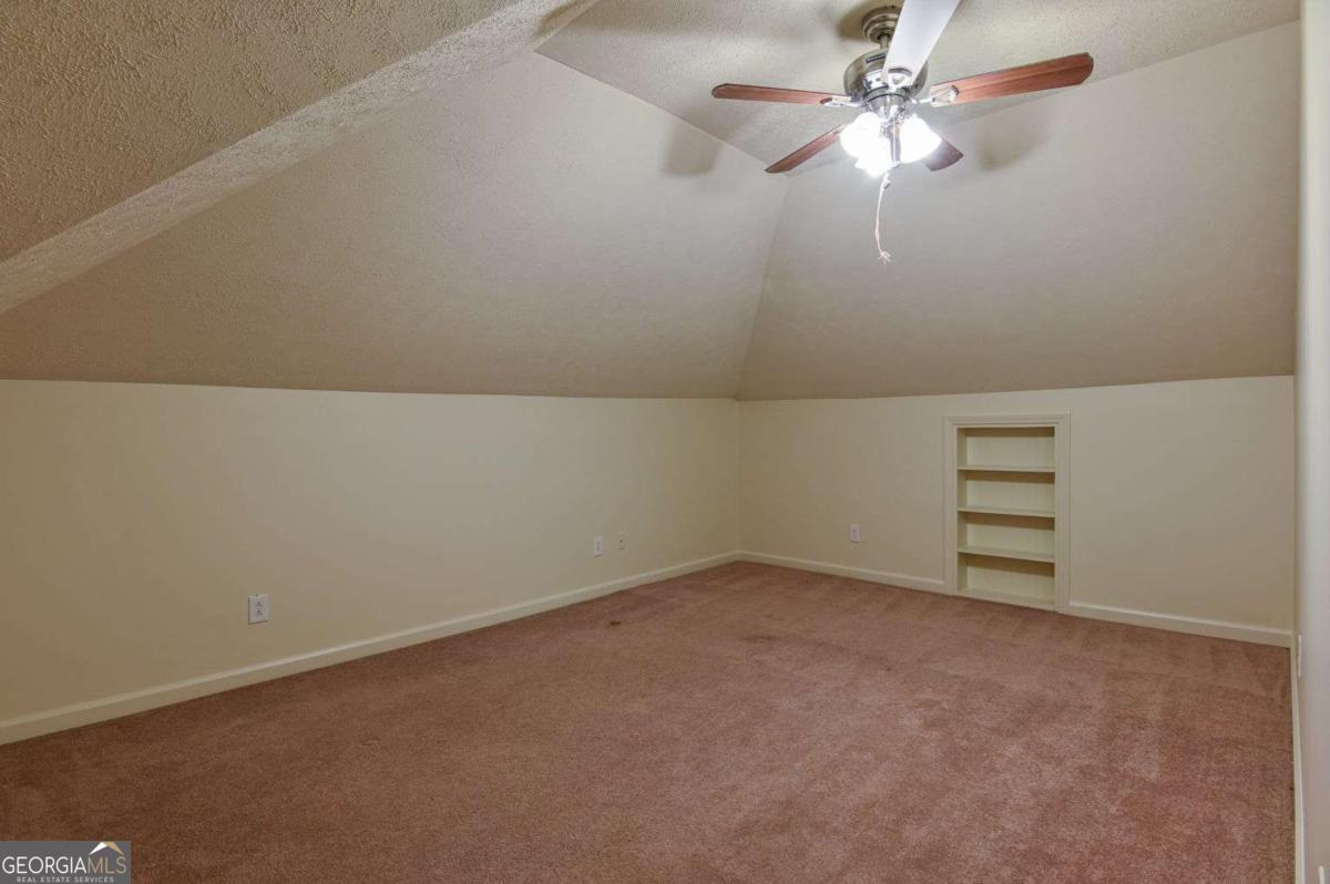 120 Tusten Street Elberton, GA 30635 - Photo 39 of 49 an empty room with a fan & a window