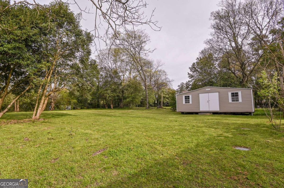 120 Tusten Street Elberton, GA 30635 - Photo 46 of 49 a house with trees in front of it