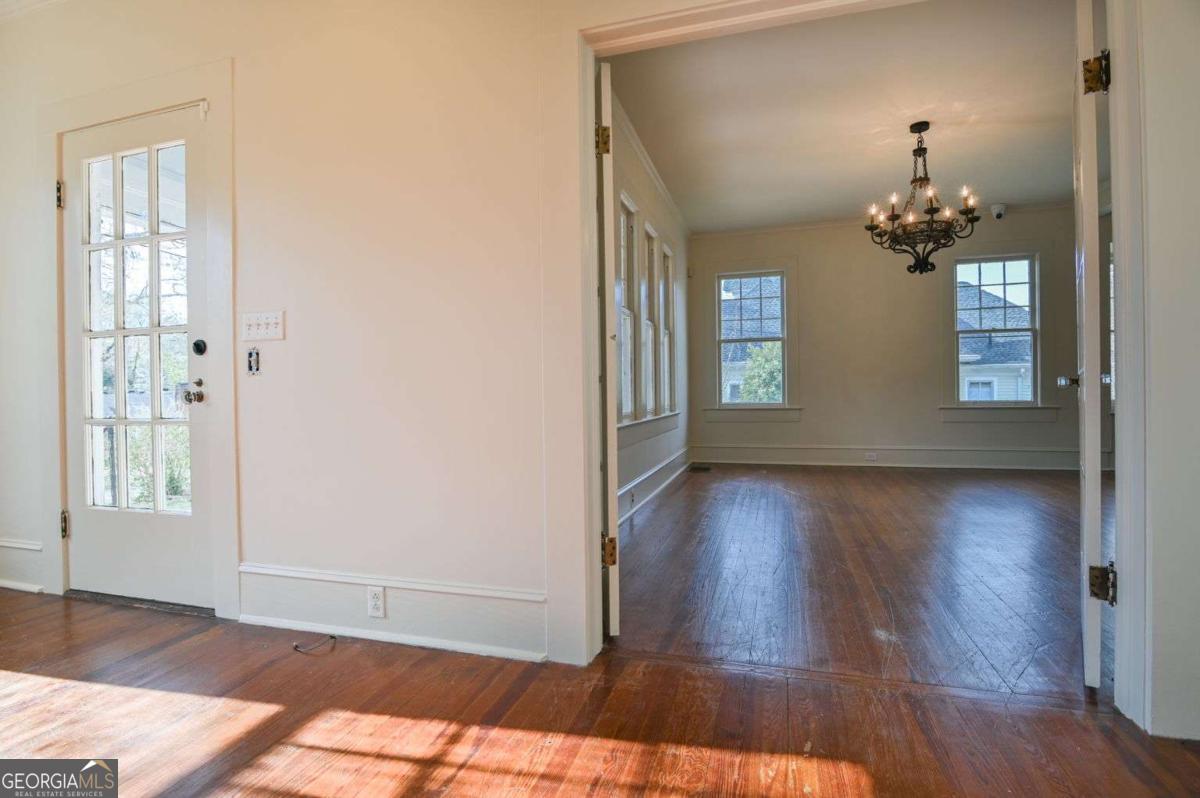 120 Tusten Street Elberton, GA 30635 - Photo 7 of 49 wooden floor in an empty room with a window