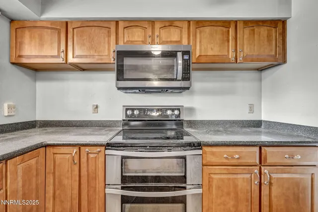a view of a livingroom with furniture and a potted plant