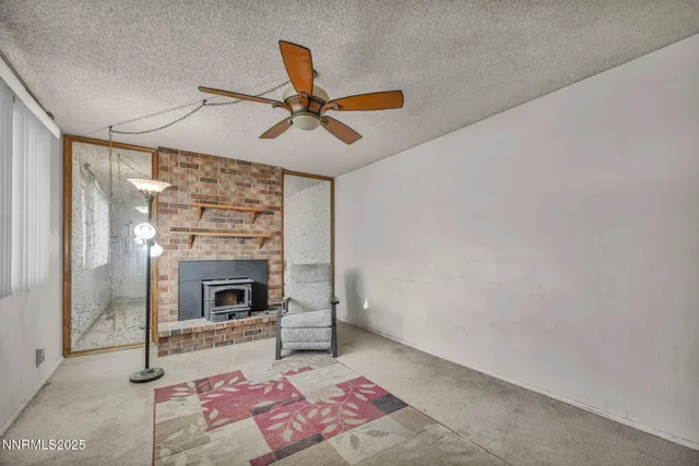 a kitchen with stainless steel appliances granite countertop a refrigerator a stove and a sink with granite countertops