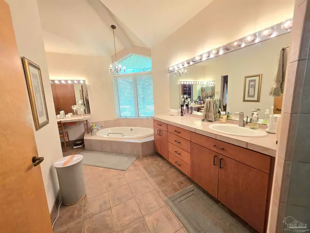 a bed room with a bed and a television