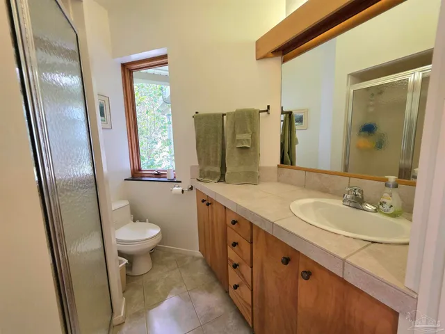 a view of a workspace with furniture and lounge chair