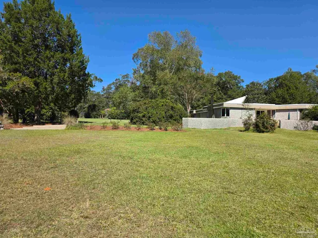 a kitchen with stainless steel appliances granite countertop a sink and a cabinets