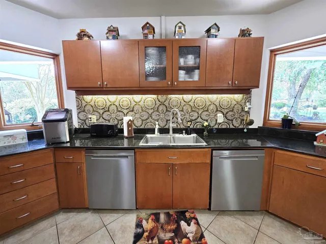 a kitchen with granite countertop lots of counter top space