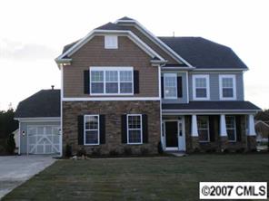 79240 Ridgehaven Road, Unit 141 Lancaster, SC 29720 - Photo 1 of 6 a front view of a house with a garden