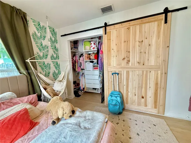 a living room with furniture a rug and a window
