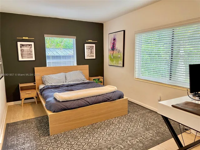 a bedroom with a bed and a couch