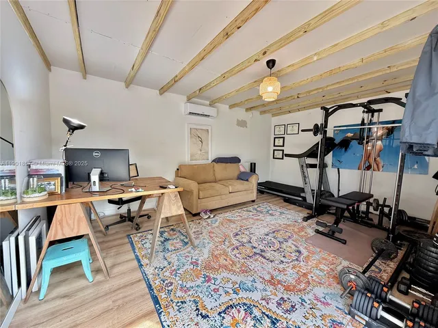 a living room with lots of furniture and a rug