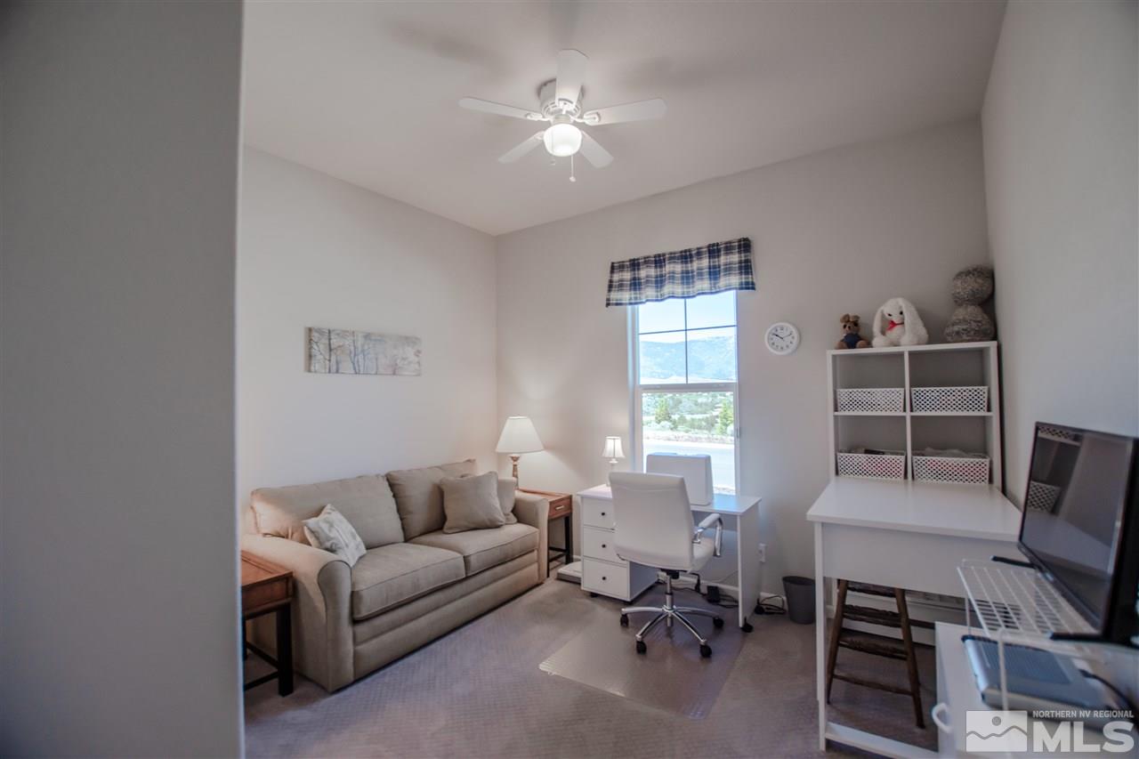 930 Broderick Trail Reno, NV 89523 - Photo 16 of 25 a living room with furniture a air conditioner vent and a window