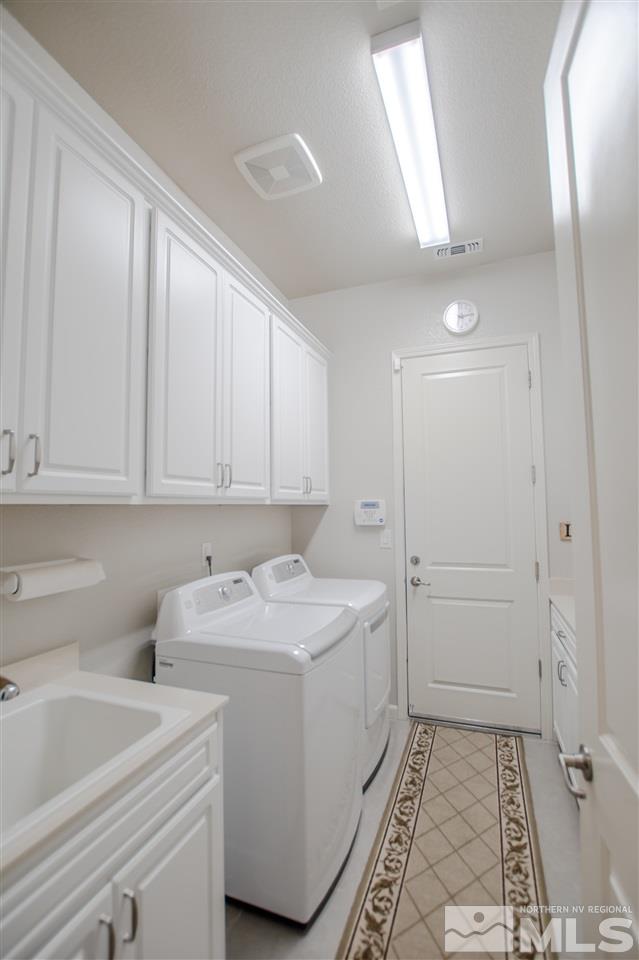 930 Broderick Trail Reno, NV 89523 - Photo 17 of 25 a room with sink dryer and washer