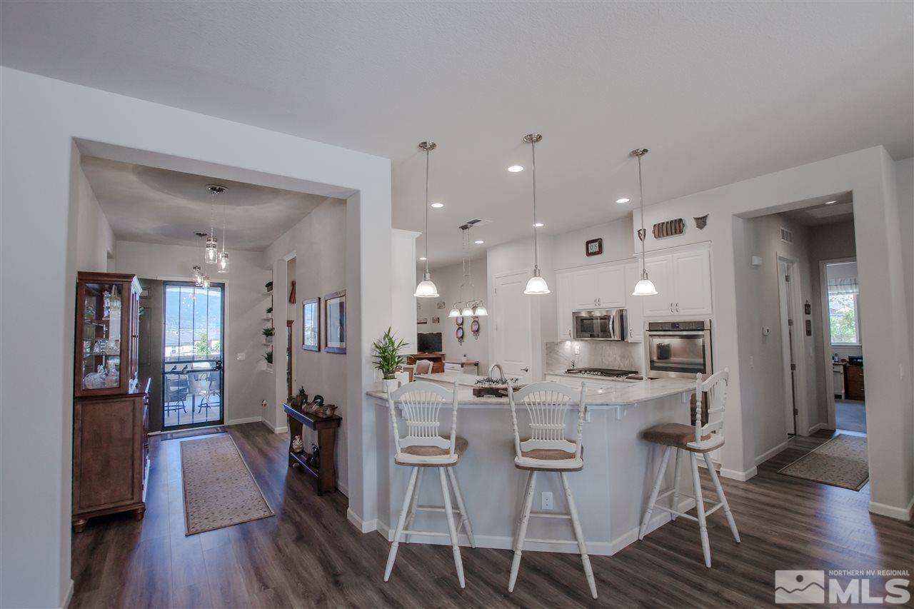 930 Broderick Trail Reno, NV 89523 - Photo 3 of 25 a view of a dining room kitchen and a wooden floor
