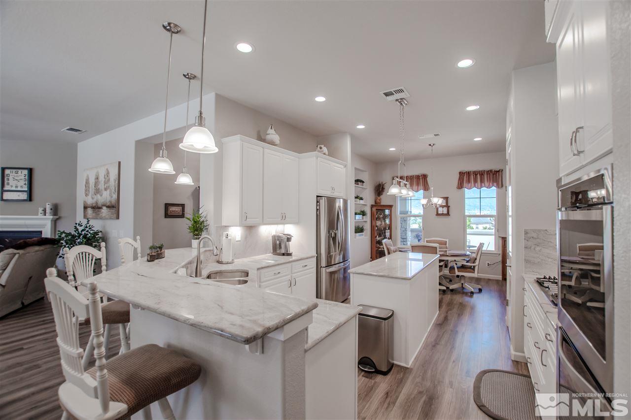 930 Broderick Trail Reno, NV 89523 - Photo 4 of 25 a large kitchen with a table and chairs