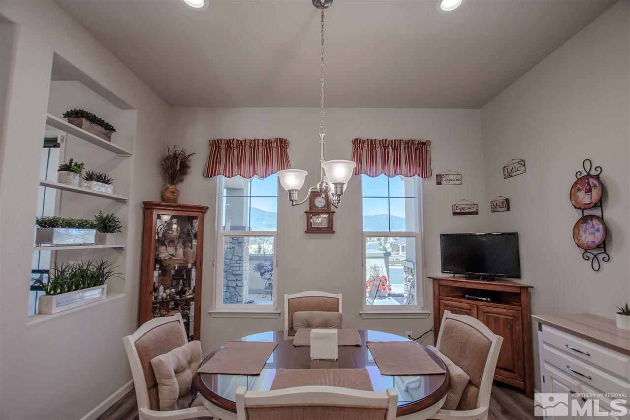 930 Broderick Trail Reno, NV 89523 - Photo 7 of 25 a living room with furniture a flat screen tv and a dining table