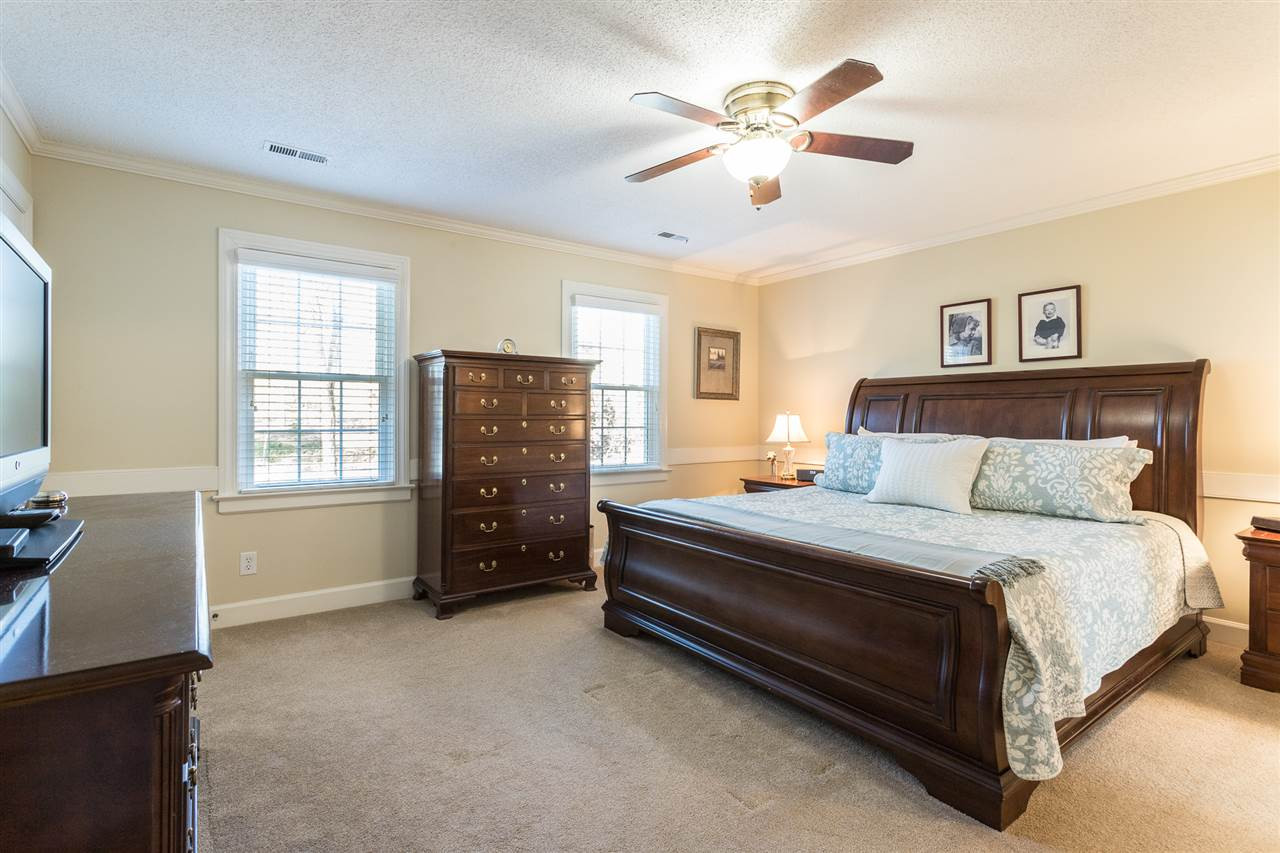 7728 Rainwater Road Raleigh, NC 27615 - Photo 15 of 30 The master suite is grand in size and offers a large walk in closet, ceiling fan, 2 window with plantation blinds, and updated master bath. Tranquil Master Suite